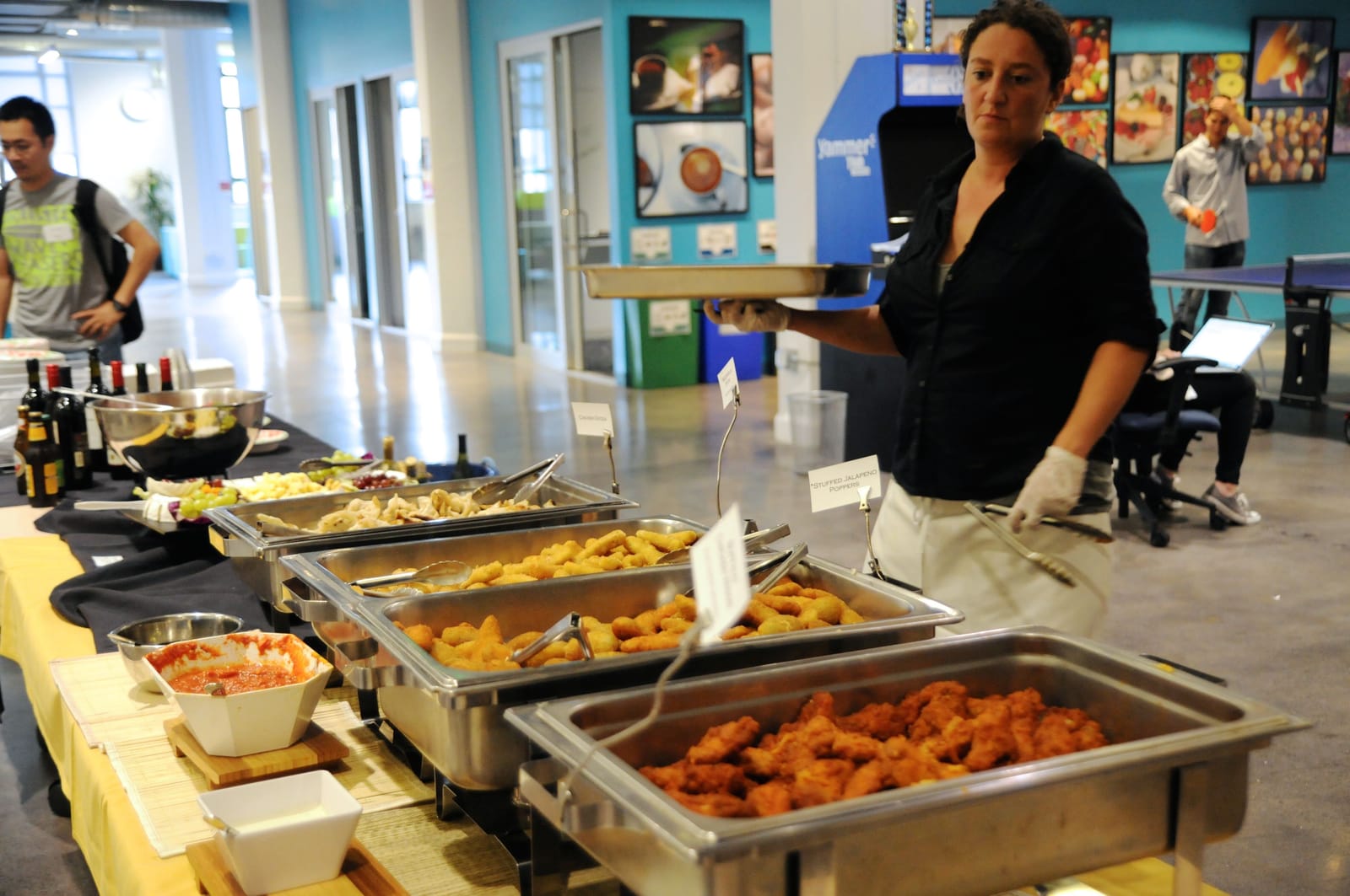 A caterer plating a buffet spread at a Cascade SF event